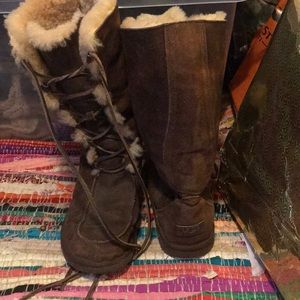 UGG lace up fur insulated winter boots.